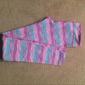 Pink, blue, and purple ivivva leggings.