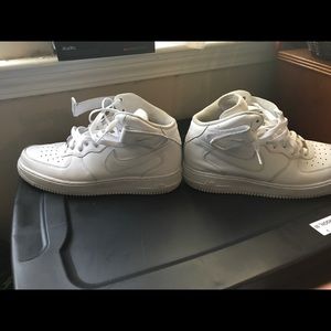 All white pair of high top nike 1's, size 10