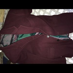 a burgundy coat jacket