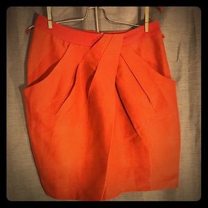 Orange front pleat skirt from Anthropologie