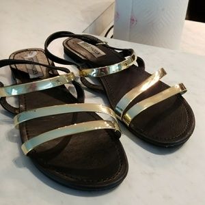 Gold and black sandals