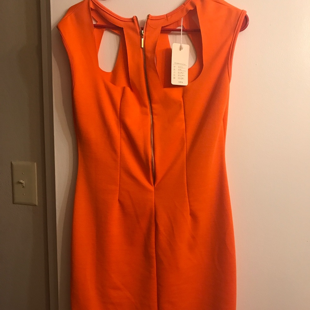 Very cute orange Stretchy material. Brand new