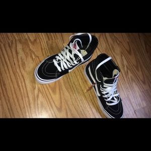 Back and white sk8 high top vans