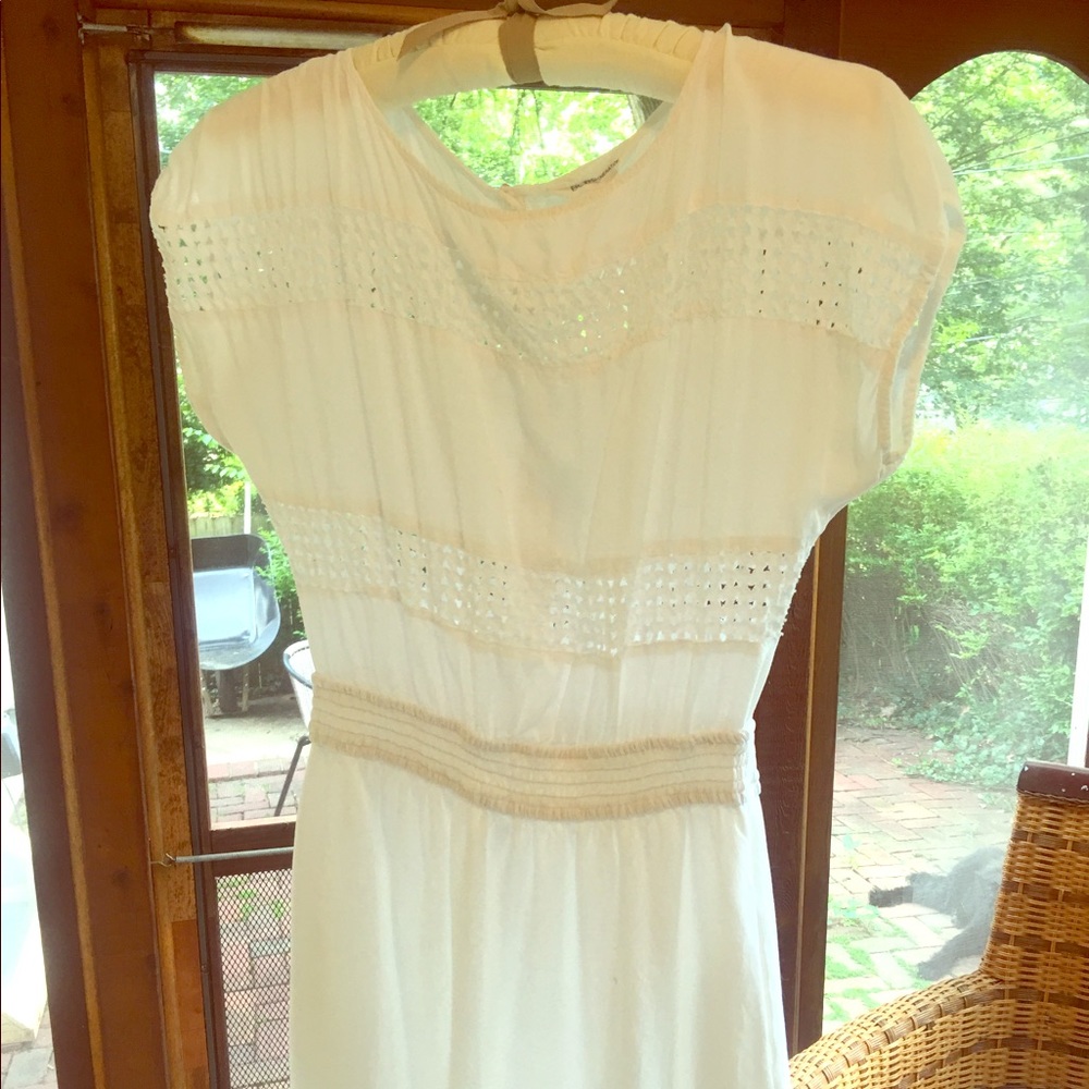 White cut-out BCBG dress with pockets.