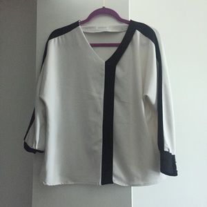 White and black asymmetrical blouse