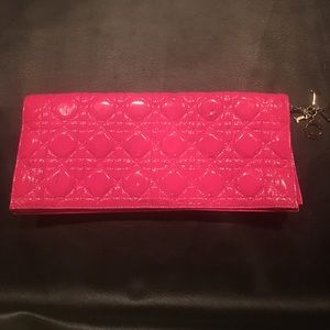Dior pink patent clutch.