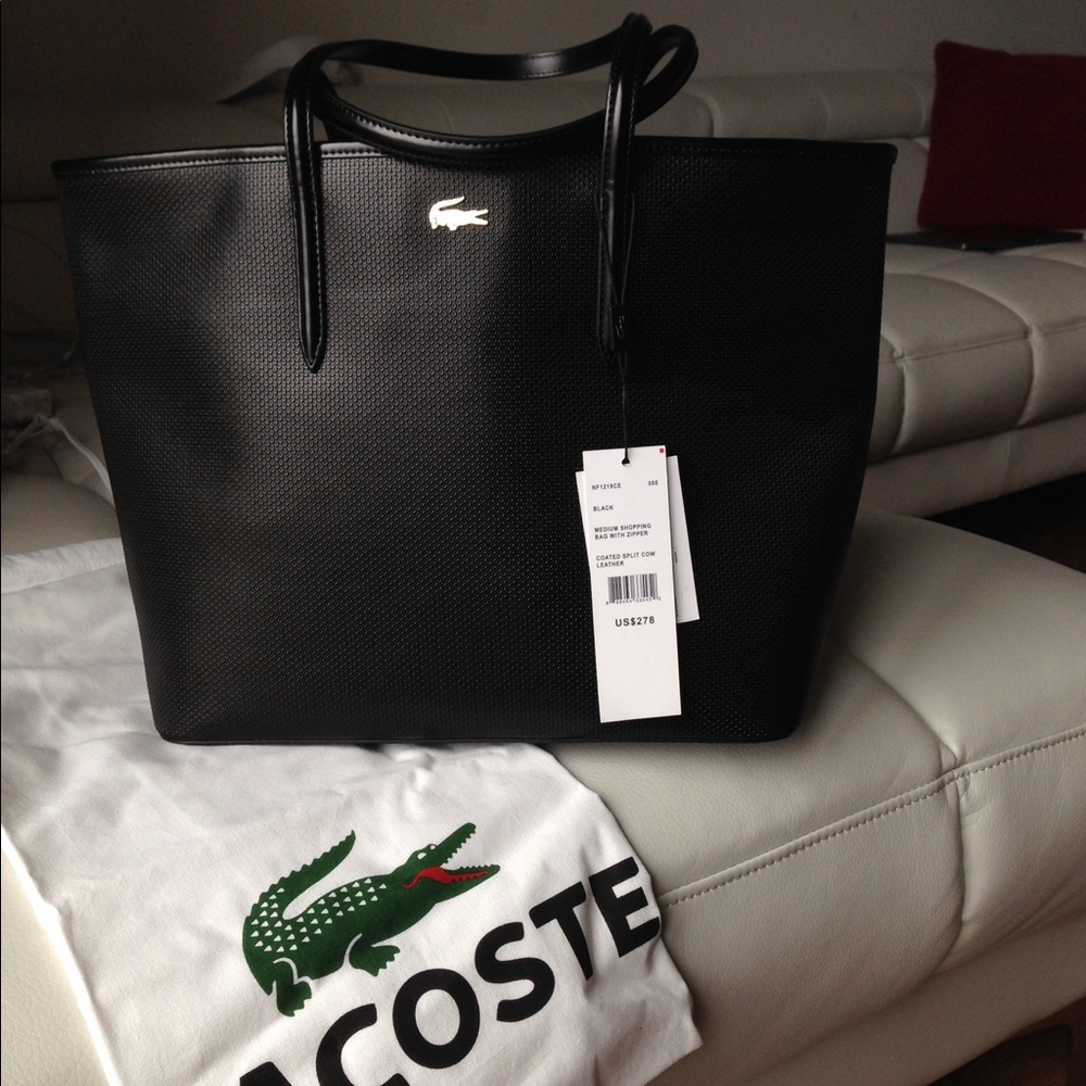 Lacoste purse and it's in brand new condition.
