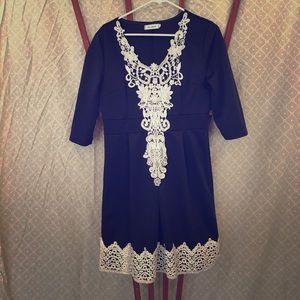 Navy blue knee length dress with white lace