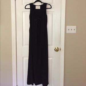 Vera Wang, full length black sleeveless dress.
