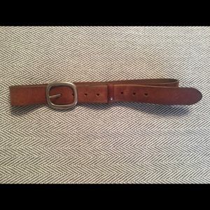 Brown leather belt with heart details.