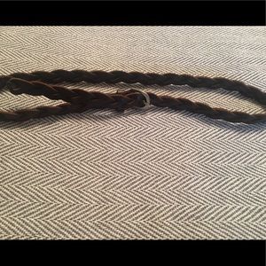 Thin, braided dark brown belt.