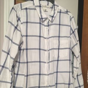White cotton shirt with blue grid design.