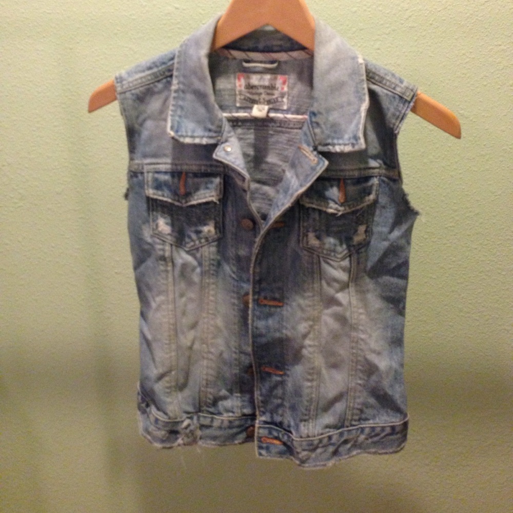 Distressed denim vest