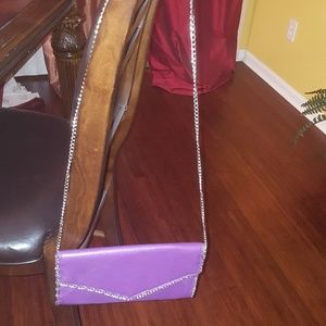 Purple leather like clutch with silver chain