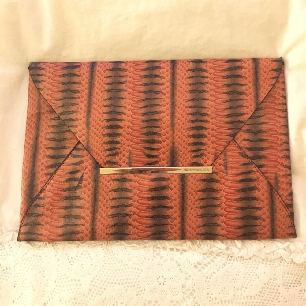 Orange snakeskin leather envelope clutch from BCBG