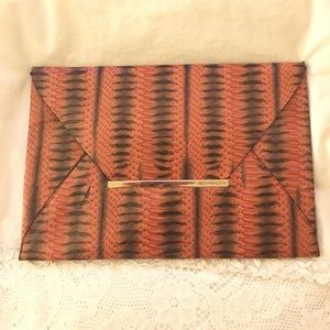 Orange snakeskin leather envelope clutch from BCBG