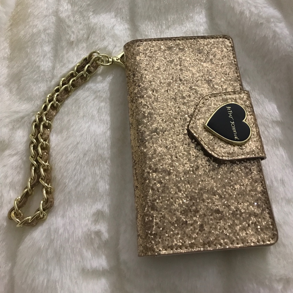 Betsy Johnson golden wristlet.