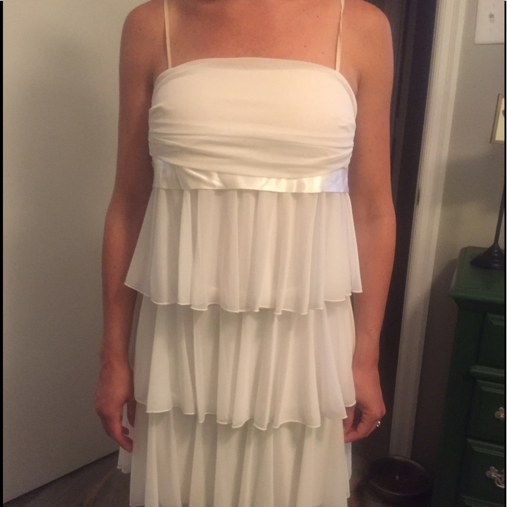 Never worn. No tags. White/cream dress