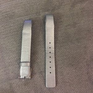 Fitbit Alta silver band.
