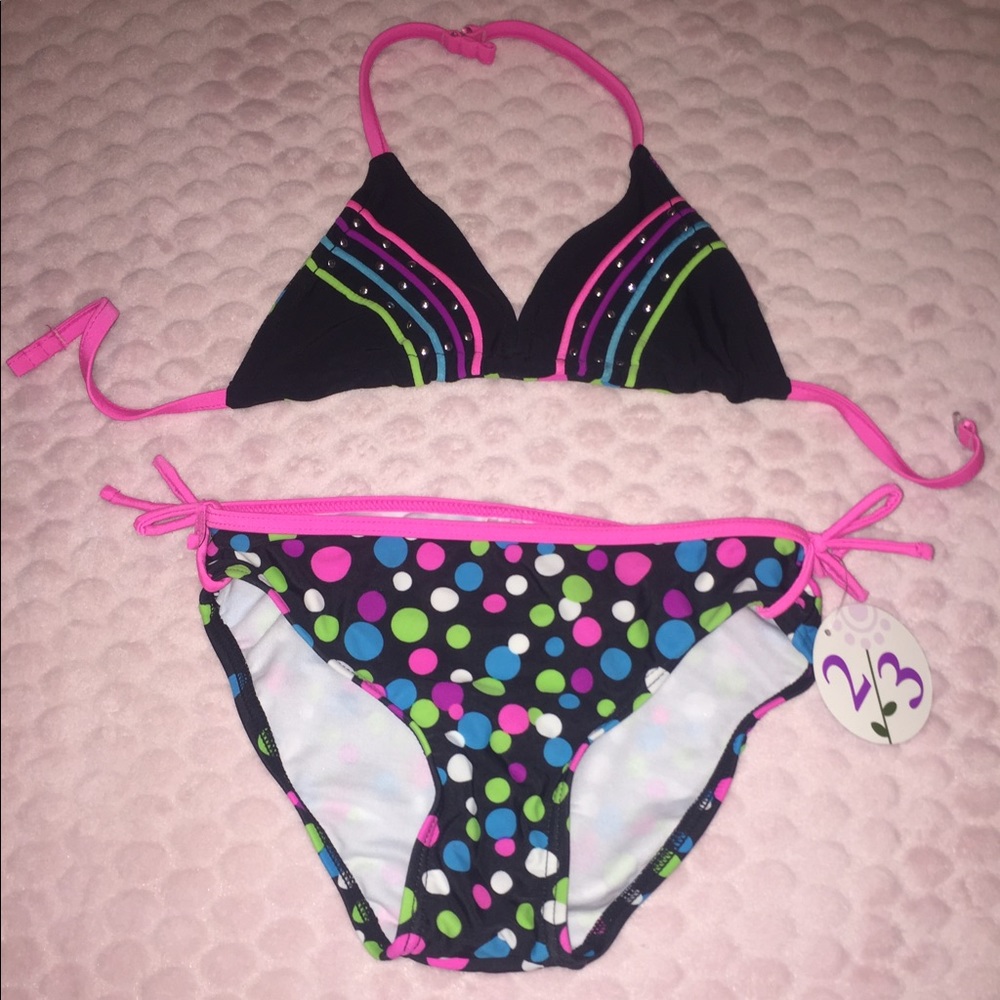 New* two piece swim suit. Reversible top. Size 10