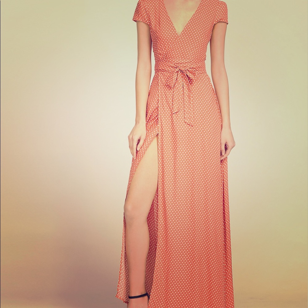 Plunge v-neck textured dot surplice wrap dress.