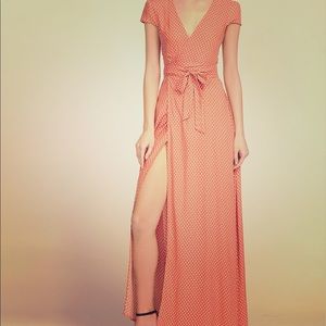 Plunge v-neck textured dot surplice wrap dress.