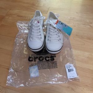 Crocs canvas lace up sneakers oyster in color.