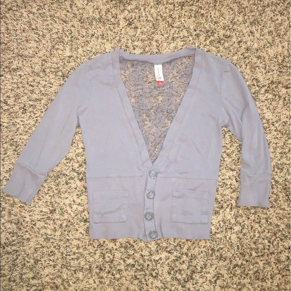 Super cute grey top with lace back.