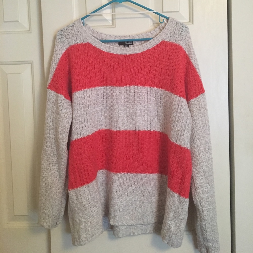 Casual Ana cable knit sweater in orange and cream.