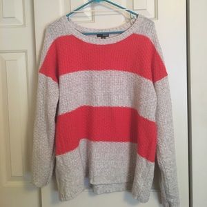 Casual Ana cable knit sweater in orange and cream.