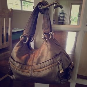 Authentic Michael Kors gold bag.