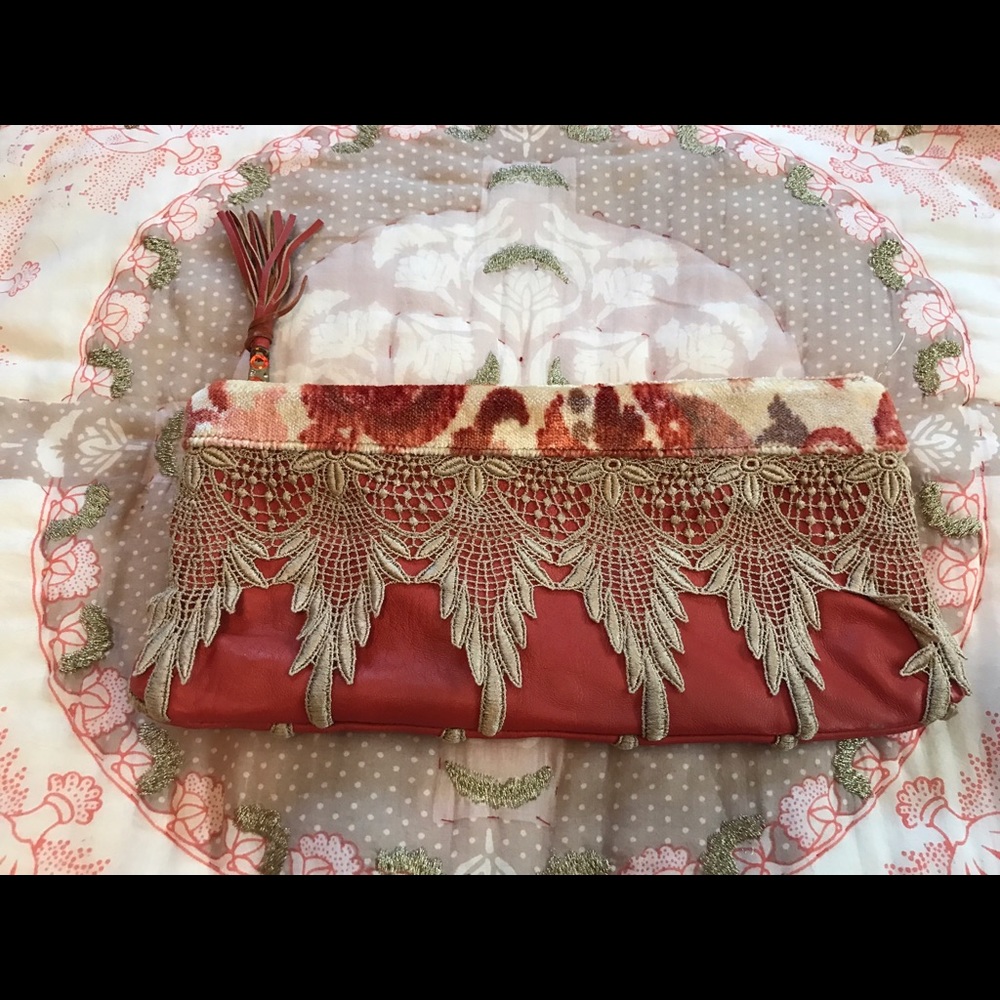 Lovely dark orange clutch with detailing