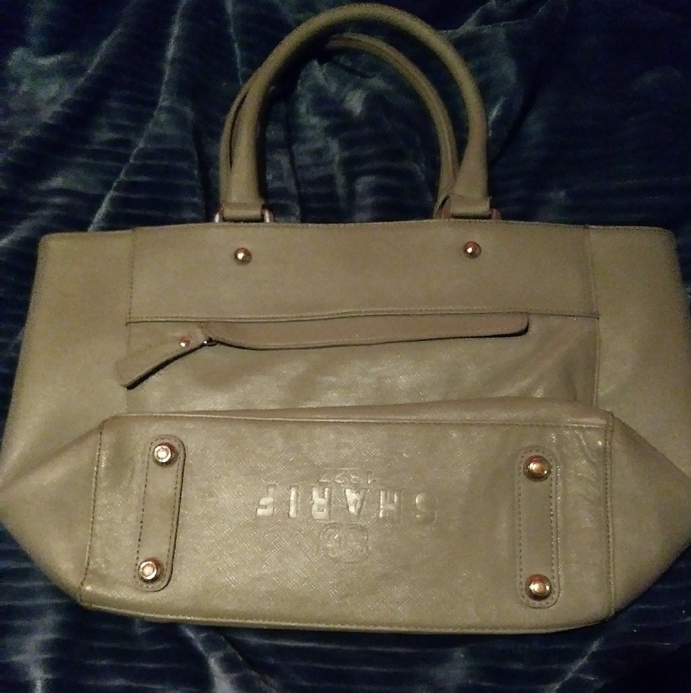 Light tan with leopard design handbag by sharif.