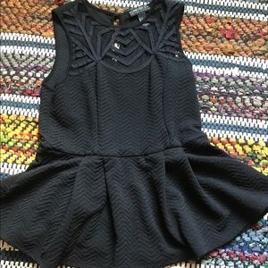 Black sleeveless peplum top