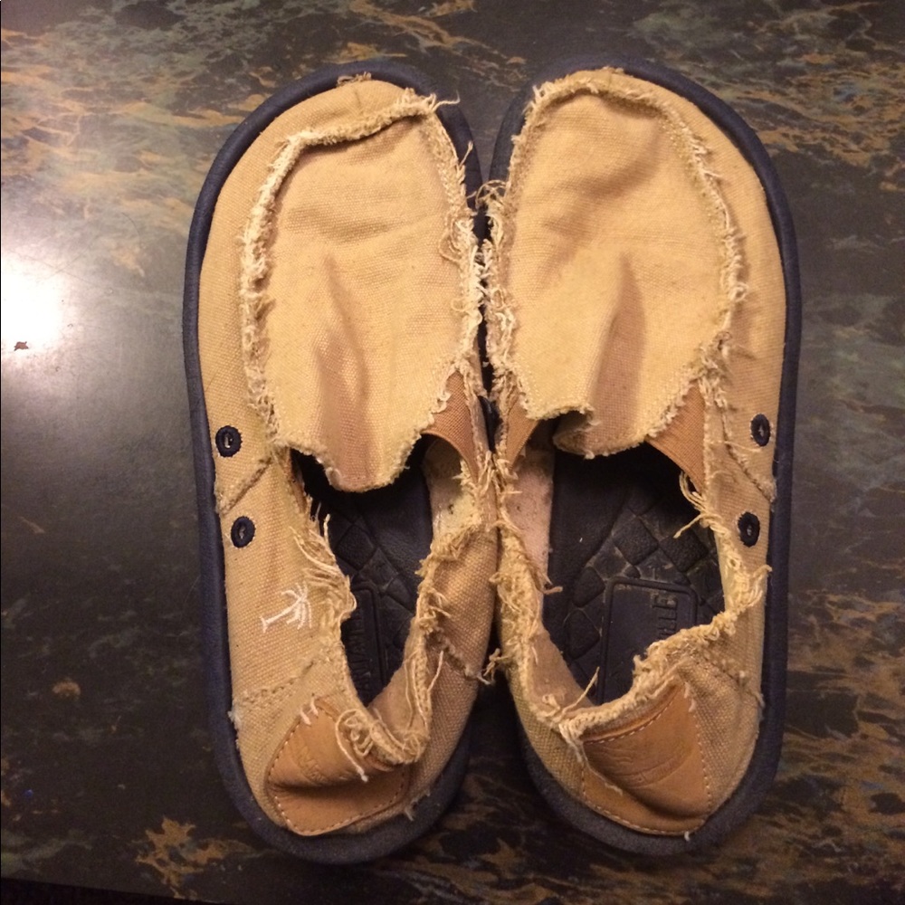 Margaritaville shoes. Tan with navy on sole.