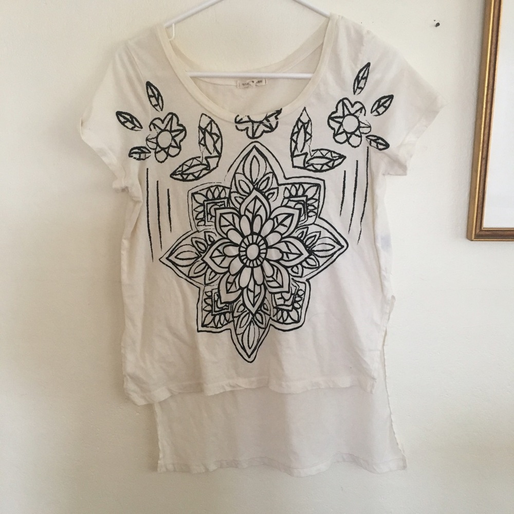 white top black floral painting [ Title Unknown ]