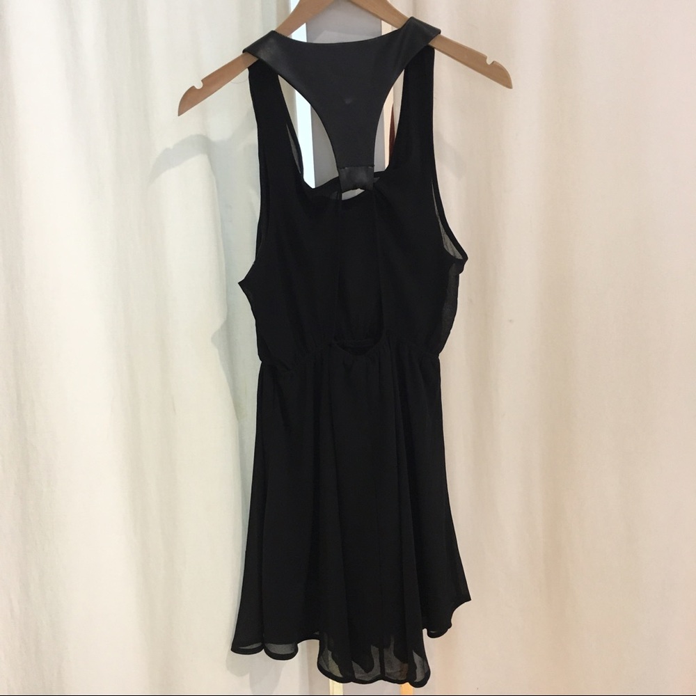 Sans Soui black pleather open racerback dress.