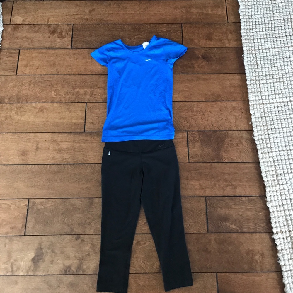 Dri fit shirt and black leggings shin height