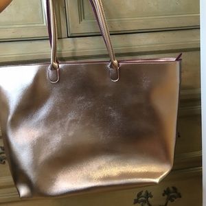Shiny metallic bag with small bag
