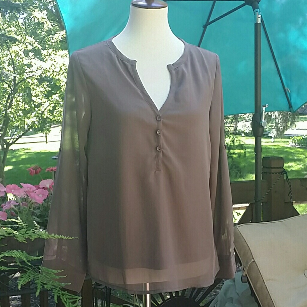 NWOT lavender. Semi sheer back with button detail.