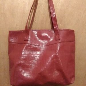Big red faux leather shoulder bag.