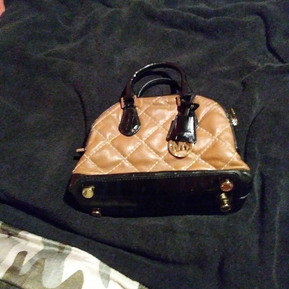 Small brown and black leather purse by Michael kor