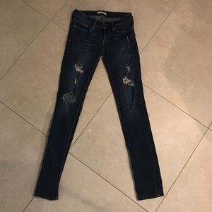 Distressed and darkwashed bullhead jeans