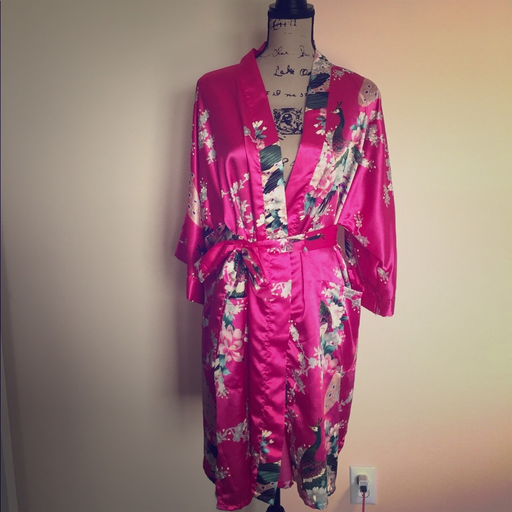 Pink robe with peacock design