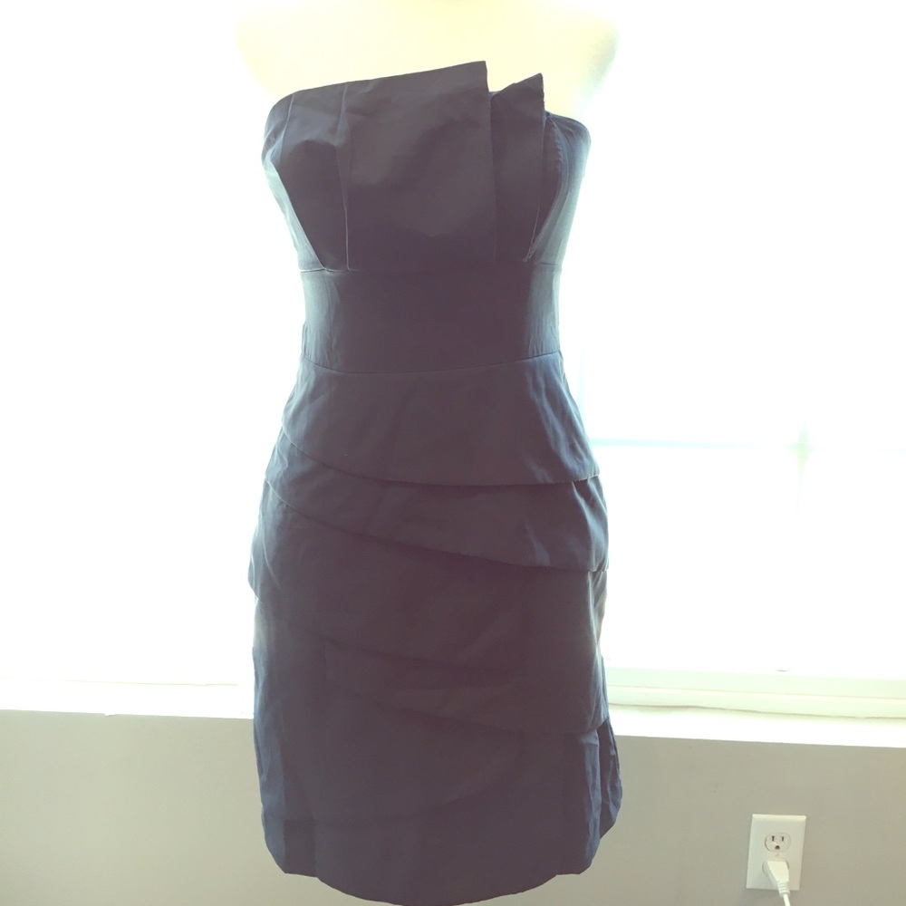 Strapless navy blue dress with origami details