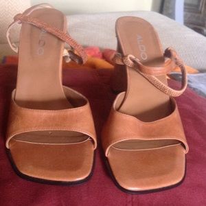 High-heeled leather sandals