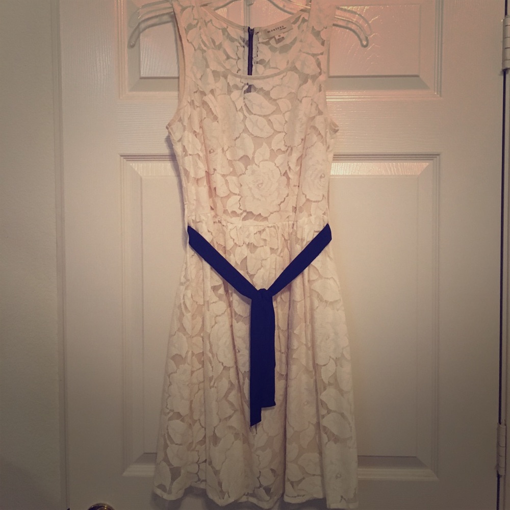 Ivory lace sleeveless dress with black sash