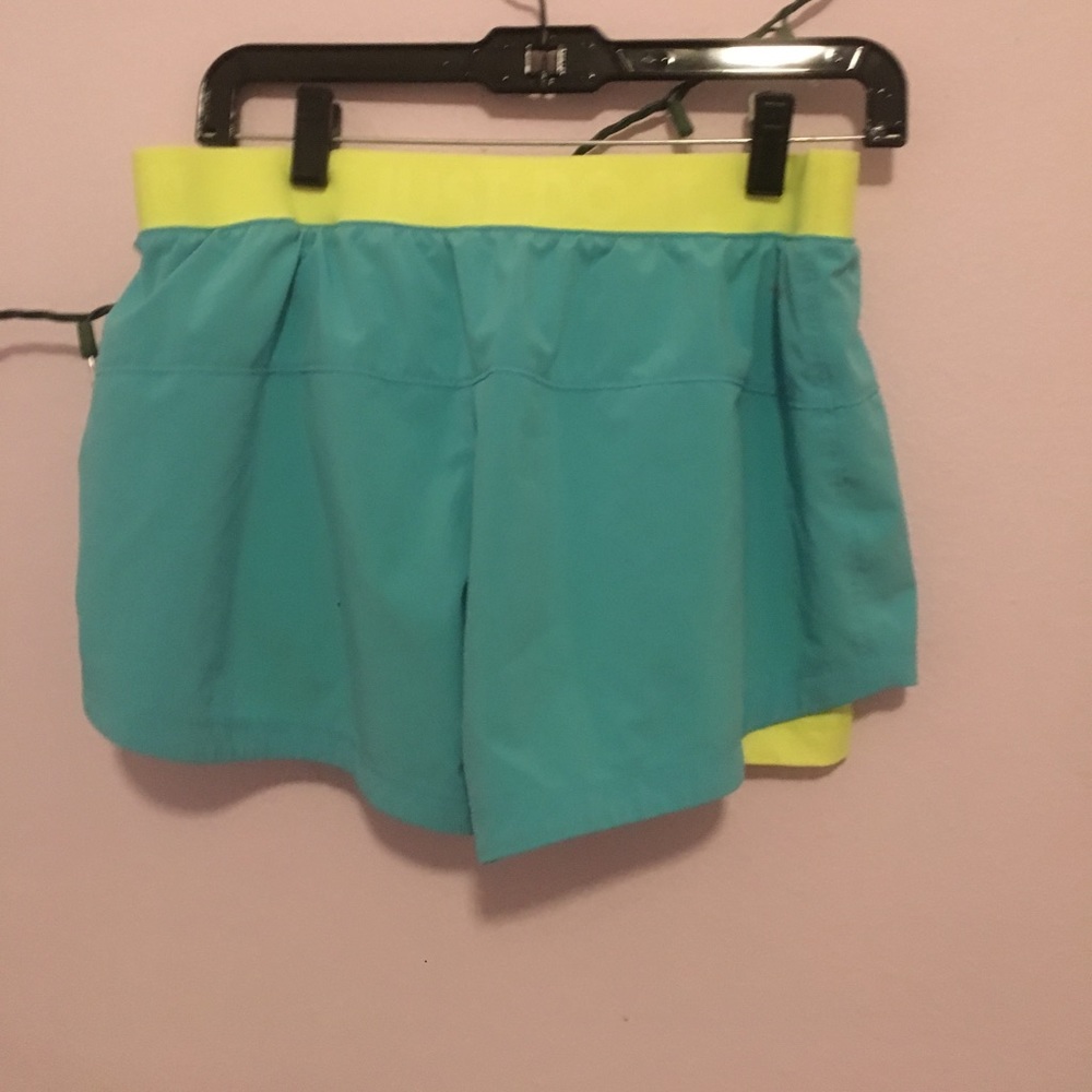 Blue and yellow Nike shorts