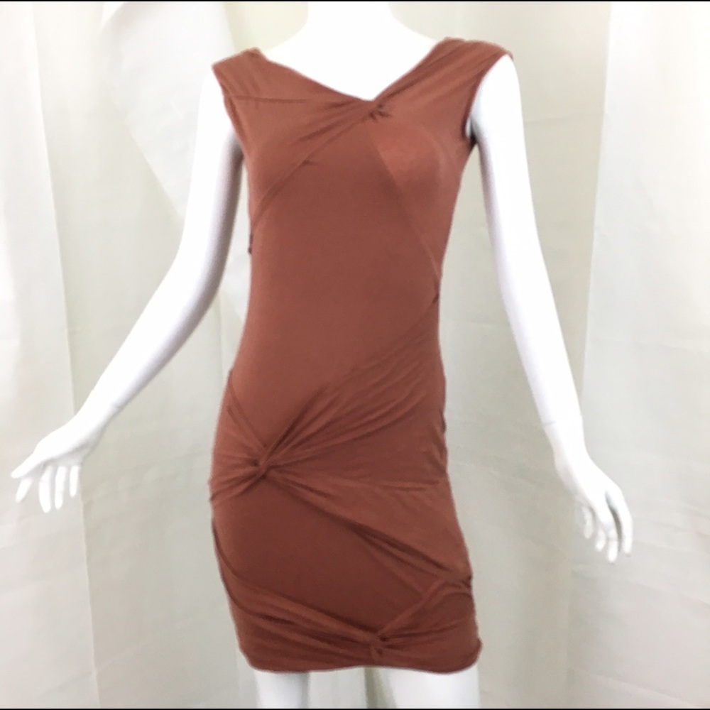 🛍 Gathered v-neck blush colored mini dress.