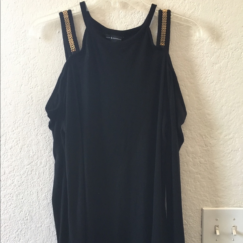 Black with gold shirt with cropped long sleeve.